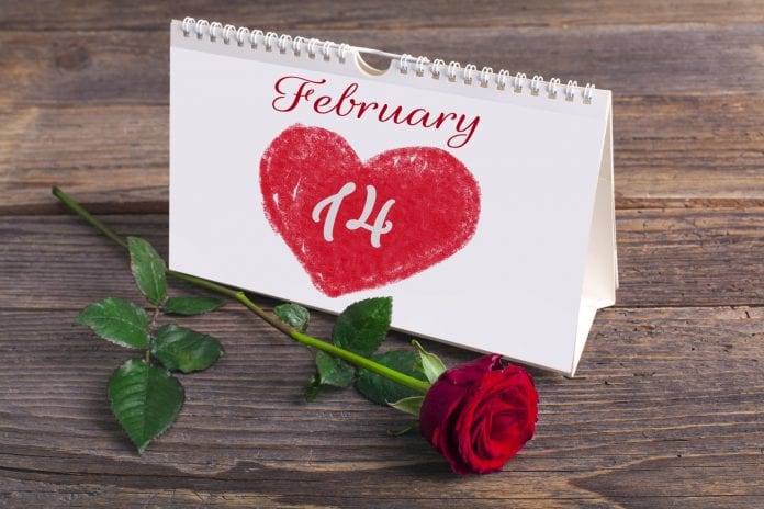 Saint Valentine calendar on rustic wooden table
